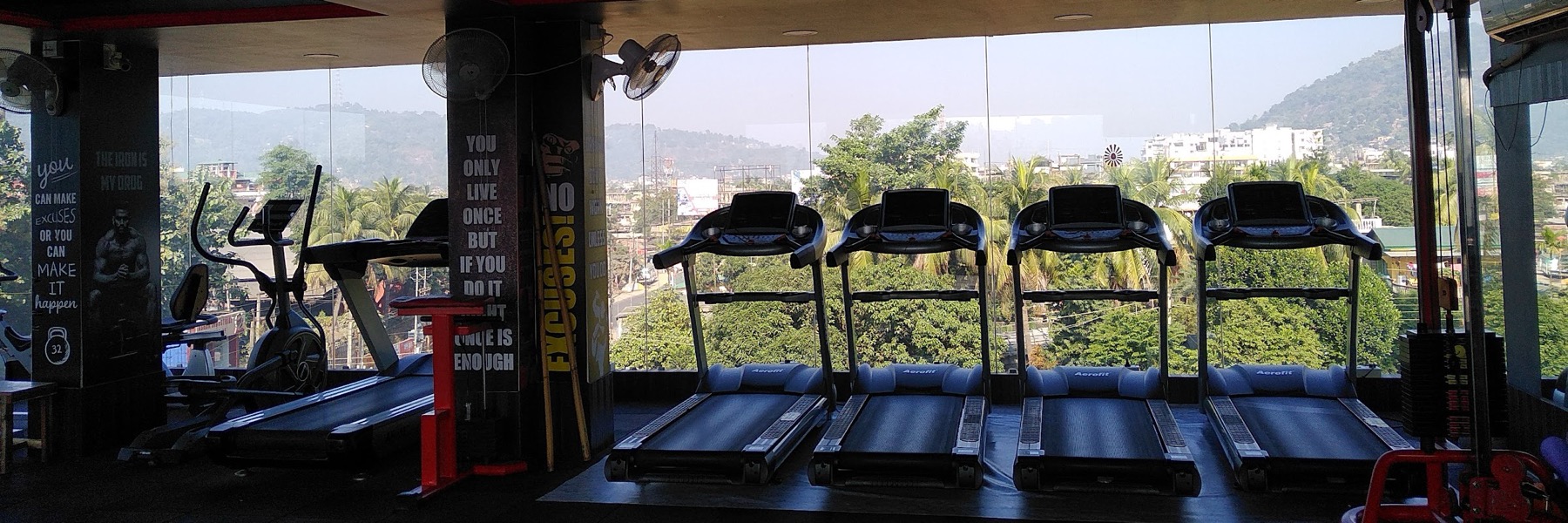 Treadmills in a row against the window